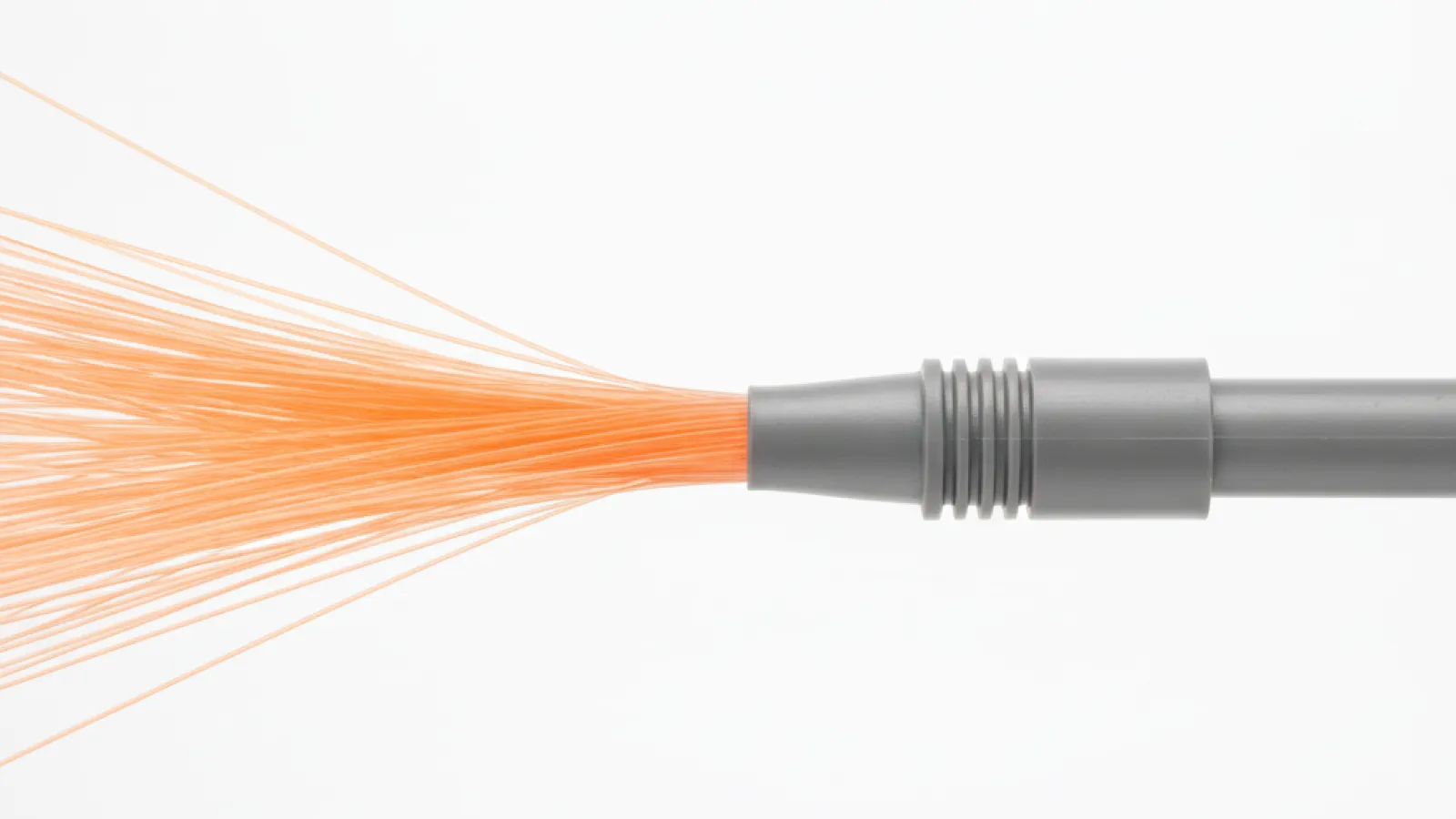 Orange fiber optic cables fan out from a gray plastic connector attached to a gray cable, all against a bright white background.